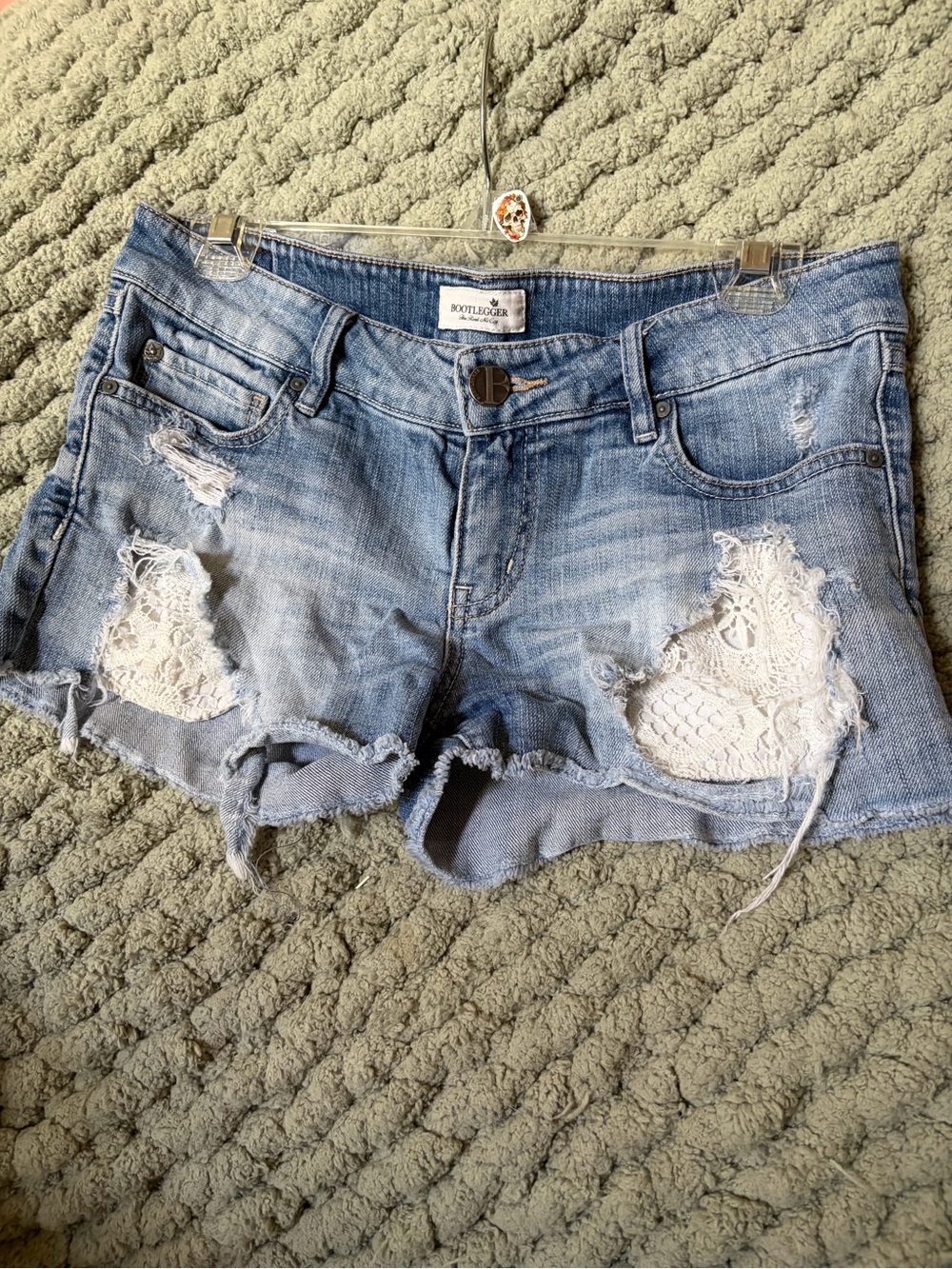 Bootlegger Light Blue Distressed Denim Crochet-Accent Shorts